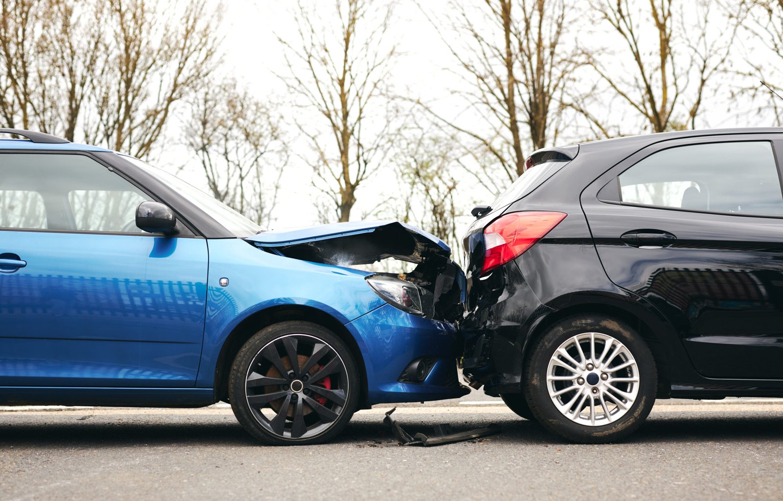 Car crash Two Damaged Cars Involved In Road Traffic Accident Showing Smoke